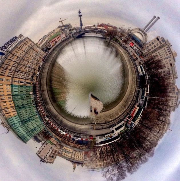 low angle view, circle, built structure, architecture, indoors, sky, cloud - sky, time, building exterior, no people, cloudy, arts culture and entertainment, day, travel destinations, famous place, directly below, reflection, place of worship, spirituality, tourism