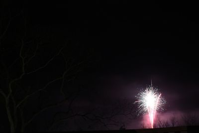 Low angle view of illuminated lights at night