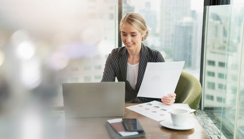 Young woman using laptop on table