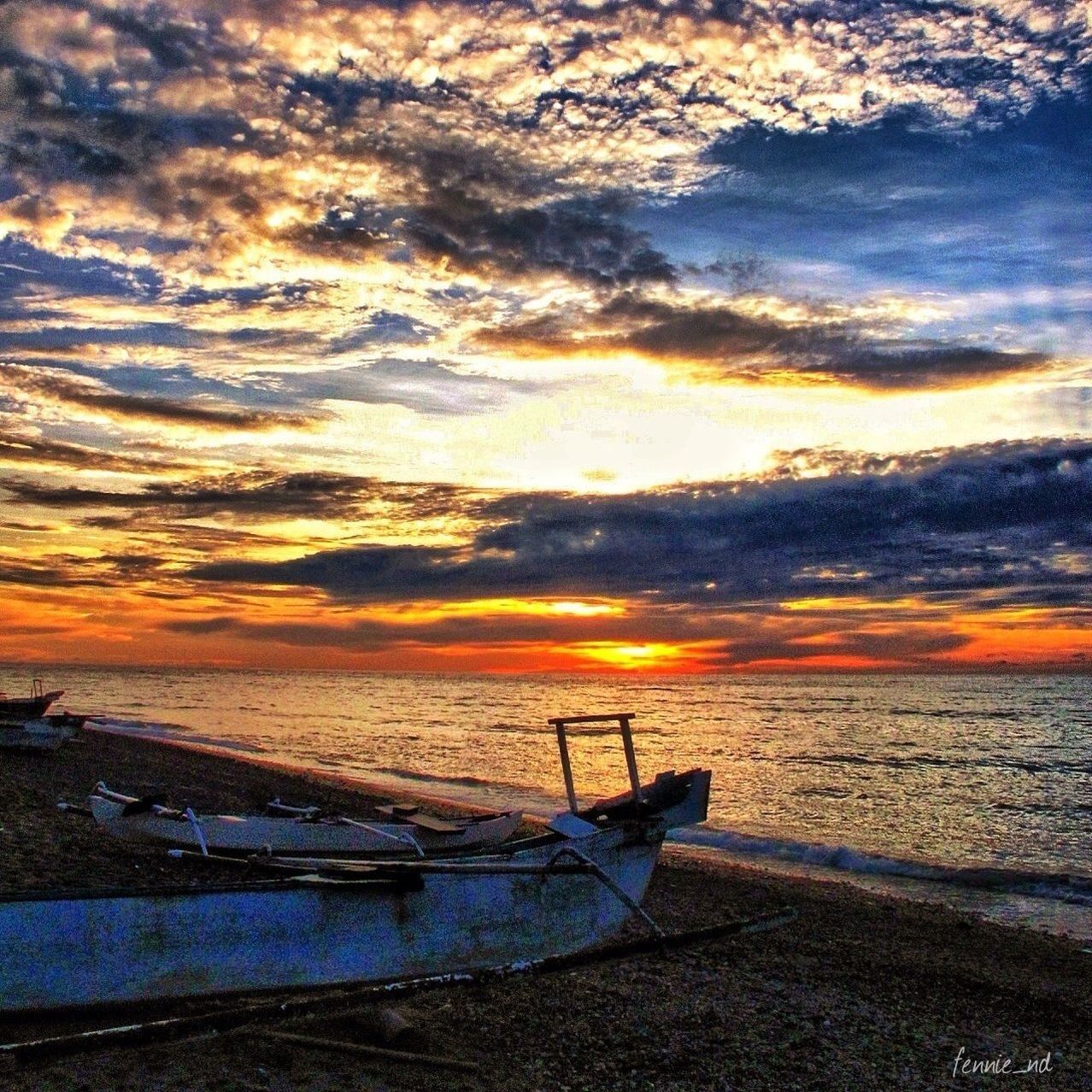 sunset, sea, water, nautical vessel, orange color, sky, transportation, boat, scenics, beauty in nature, mode of transport, beach, horizon over water, cloud - sky, tranquility, tranquil scene, nature, shore, idyllic, moored