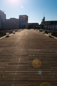 View of railroad tracks against buildings