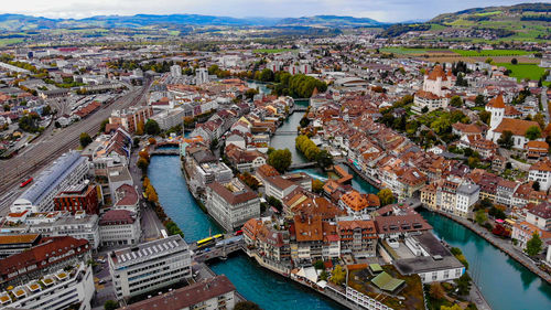 High angle view of river amidst buildings in town