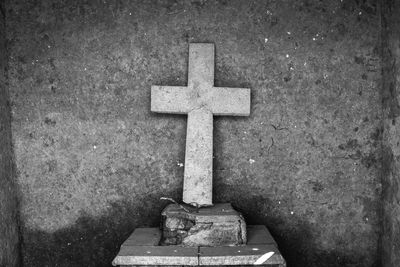 Close-up of cross in cemetery