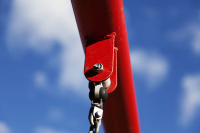 Low angle view of telephone pole against blue sky