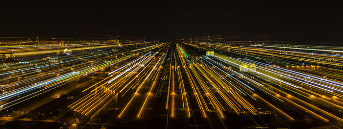 High angle view of light trails against sky at night