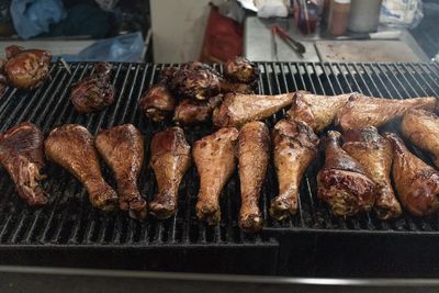High angle view of meat on barbecue grill