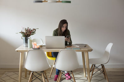 Young woman working at home