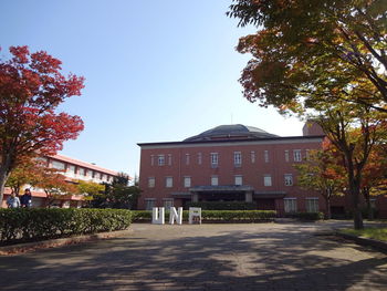 Street by building against sky