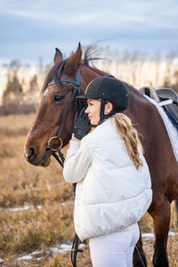 Rear view of horse standing on field