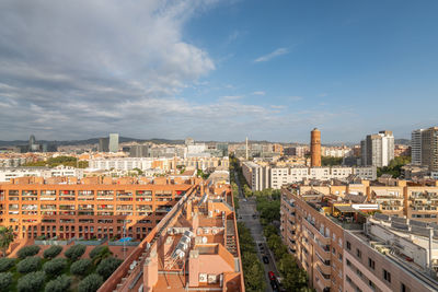 High angle view of buildings in city against sky