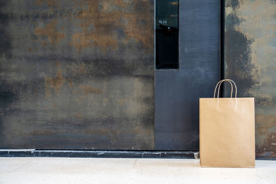 Close-up of metal door against building