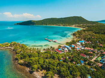 High angle view of sea and mountains against sky