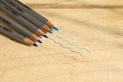 High angle view of colored pencils on table