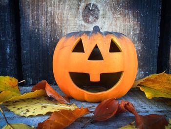 Close-up of pumpkin on stone wall during halloween