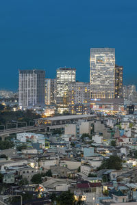 Aerial view of buildings in city at night