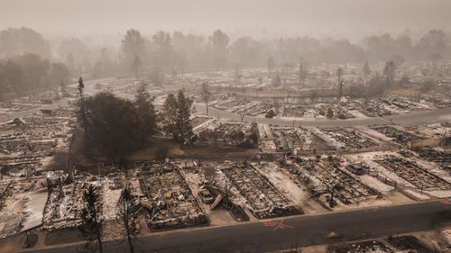 Wild fire destroys people's mobile homes and flips lives upside down after fire blows through town.