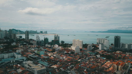 High angle view of buildings against sky in city