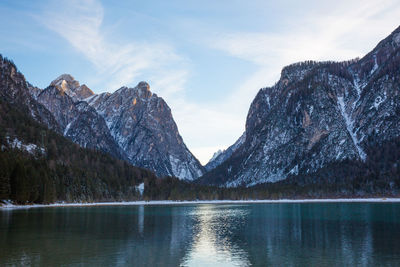 Scenic view of lake and mountains against sky