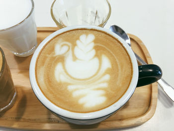Close-up of cappuccino on table
