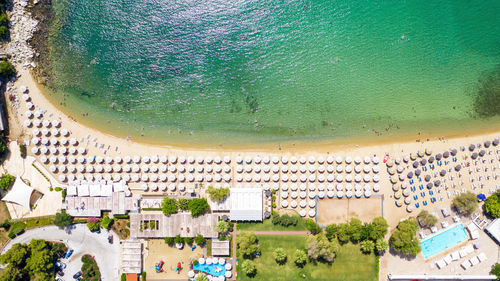 High angle view of sea and buildings in city