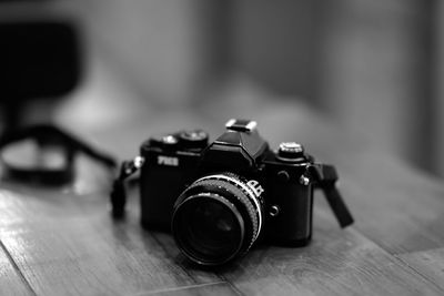 Close-up of camera on table