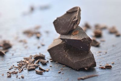 Close-up of chocolate on table against white background