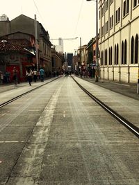 View of railroad tracks by buildings in city