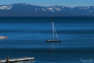 Scenic view of sea against mountain