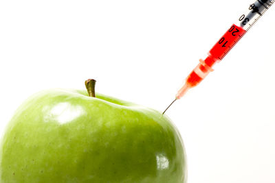 Close-up of apple against white background