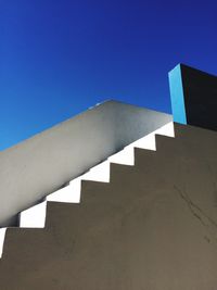 Low angle view of built structure against clear blue sky