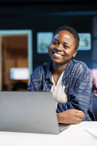 Young man using laptop at home