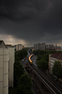 High angle view of cityscape against storm clouds