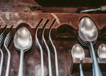 Vintage cutlery in vintage wooden box. soft focus background, close up