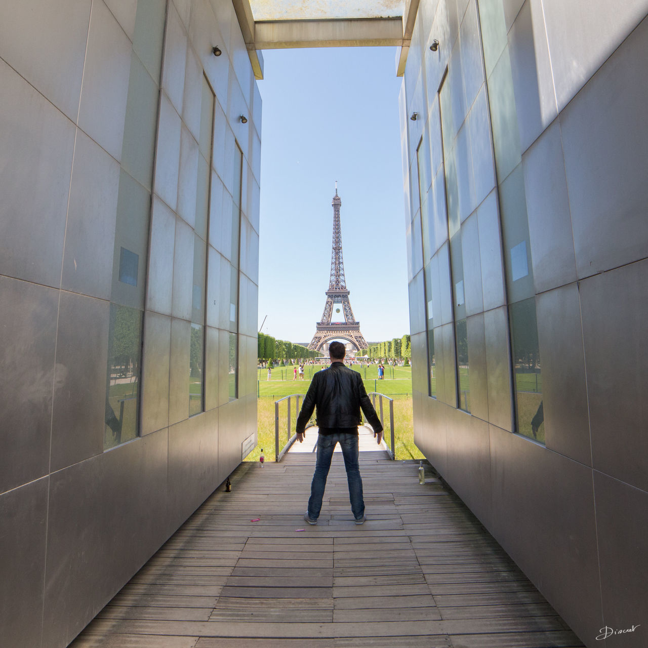 architecture, built structure, building exterior, rear view, walking, full length, lifestyles, city, men, tower, famous place, travel destinations, tall - high, international landmark, tourism, travel, the way forward, capital cities