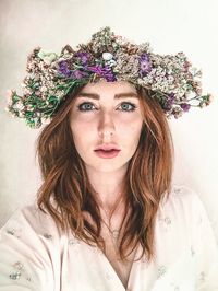 Portrait of beautiful woman with pink flower