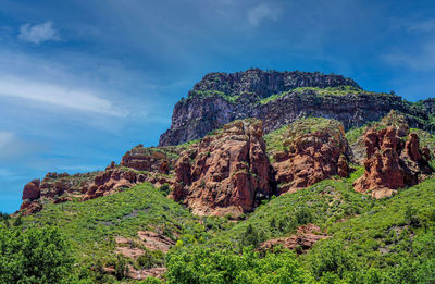 Rock formation on mountain against sky