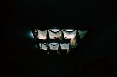 Close-up of illuminated lantern over black background