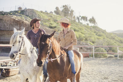 Full length of man riding horse