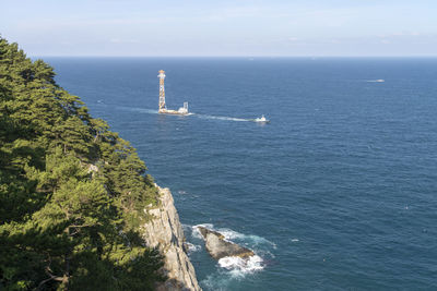 High angle view of sailing ship in sea against sky