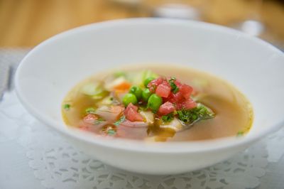 Close-up of soup in bowl on tablecloth