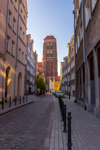 City street amidst buildings against sky