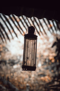 Low angle view of electric lamp on roof