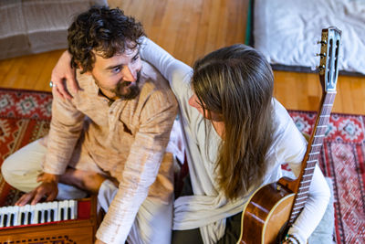 Young couple playing at music concert