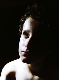 Close-up of boy in darkroom