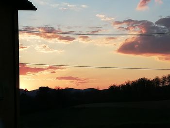 Scenic view of silhouette landscape against sky during sunset