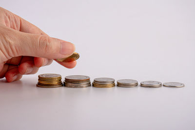 Cropped image of hand holding coins