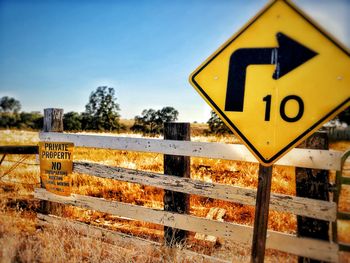 Close-up of arrow sign on railroad track