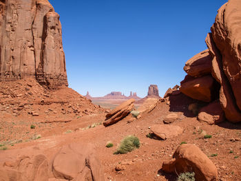 Rock formations in desert against clear sky