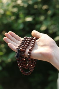 Close-up of woman holding hand