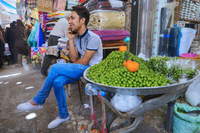 Man preparing food for sale at market stall